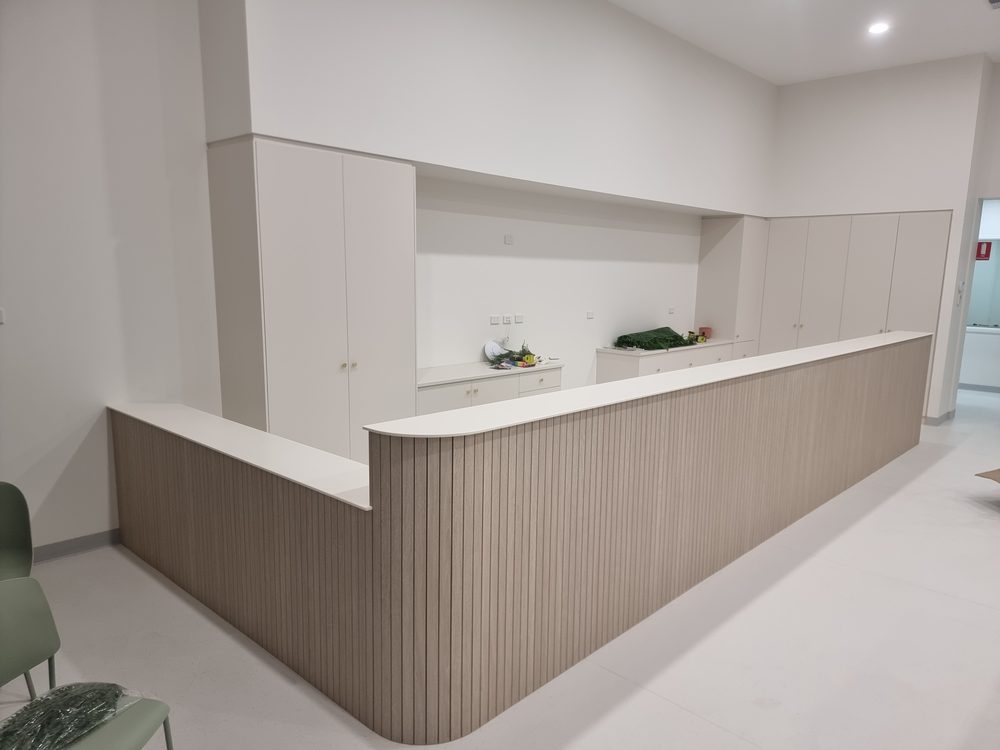 Custom kitchen with a white and timber waterfall island bench