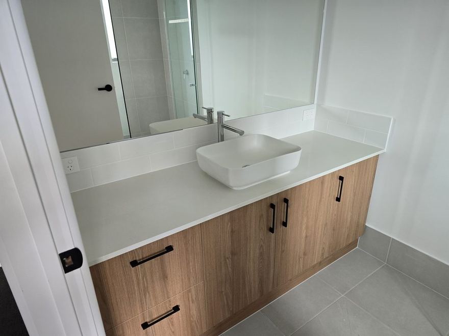 Bathroom with a timber double vanity and large mirror