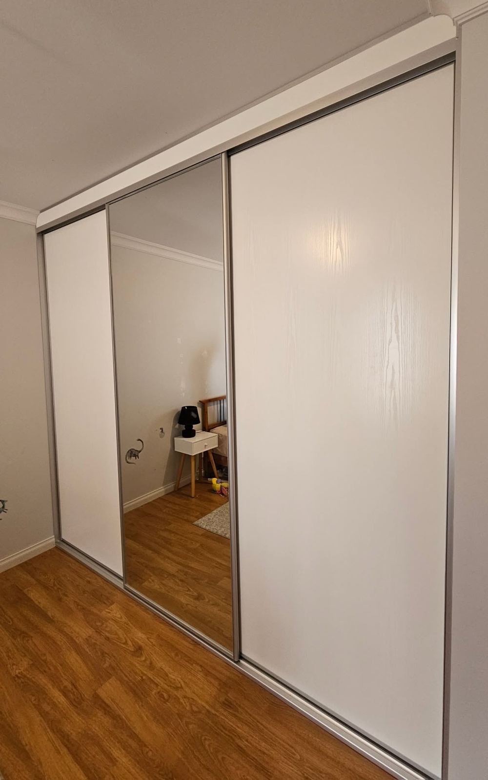 White gloss sliding wardrobe with mirror doors